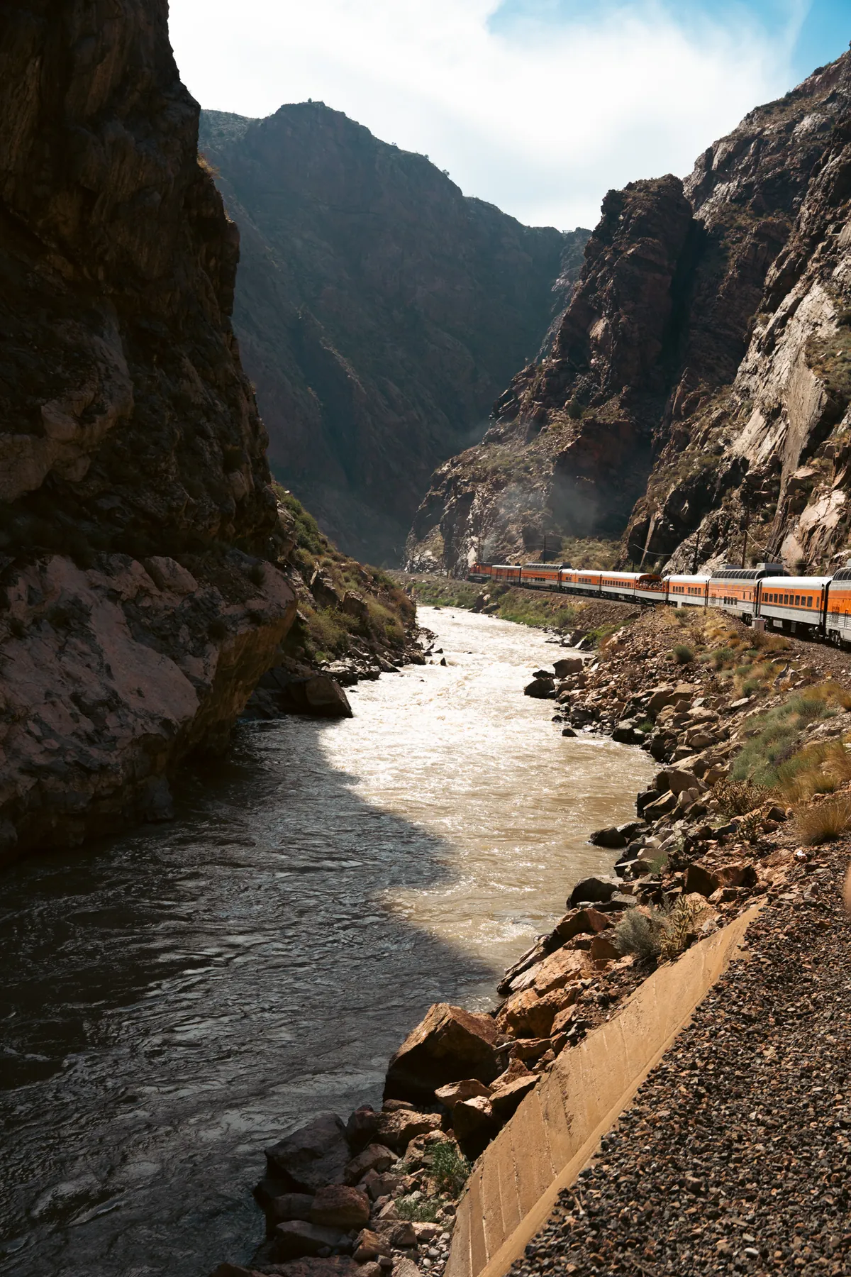 River winding through a canyon beside a railway
